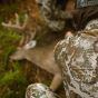 First Lite Trace Quarter Zip in Specter camo with low-profile collar, deep zipper, and bino-harness compatible chest pockets

