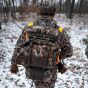 First Lite Transfer Lite Pack in Specter camo with detachable waist pack, MOLLE platforms, and integrated 28-foot gear hoist
