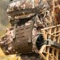 First Lite Transfer Lite Pack in Specter camo with detachable waist pack, MOLLE platforms, and integrated 28-foot gear hoist
