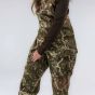 First Lite Women’s Phase Bib in Specter camo with windproof fleece softshell, magnetic cargo pockets, and full-length side zips
